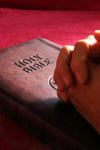 Prayer and Intercession Holy Bible folded hands